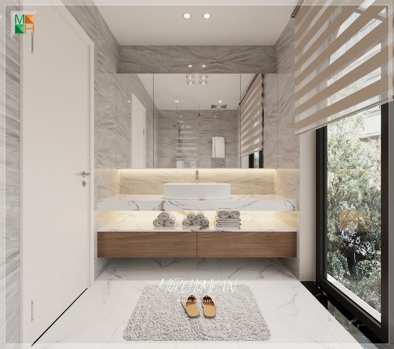 Bàn đá lavabo màu trắng kèm vân mây tinh tế tạo cảm giác thoáng mát và sạch sẽ mỗi khi bước chân vào căn phòng.