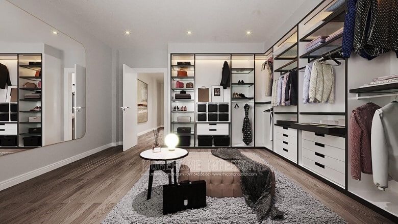 Trang trí nội thất phòng thay đồ đẹp với tủ quần áo gỗ hiện đại, gương treo tường size lớn cốt bỉ cao cấp, thảm trải sàn lông cừu nhập khẩu, sàn gỗ công nghiệp hiện đại.